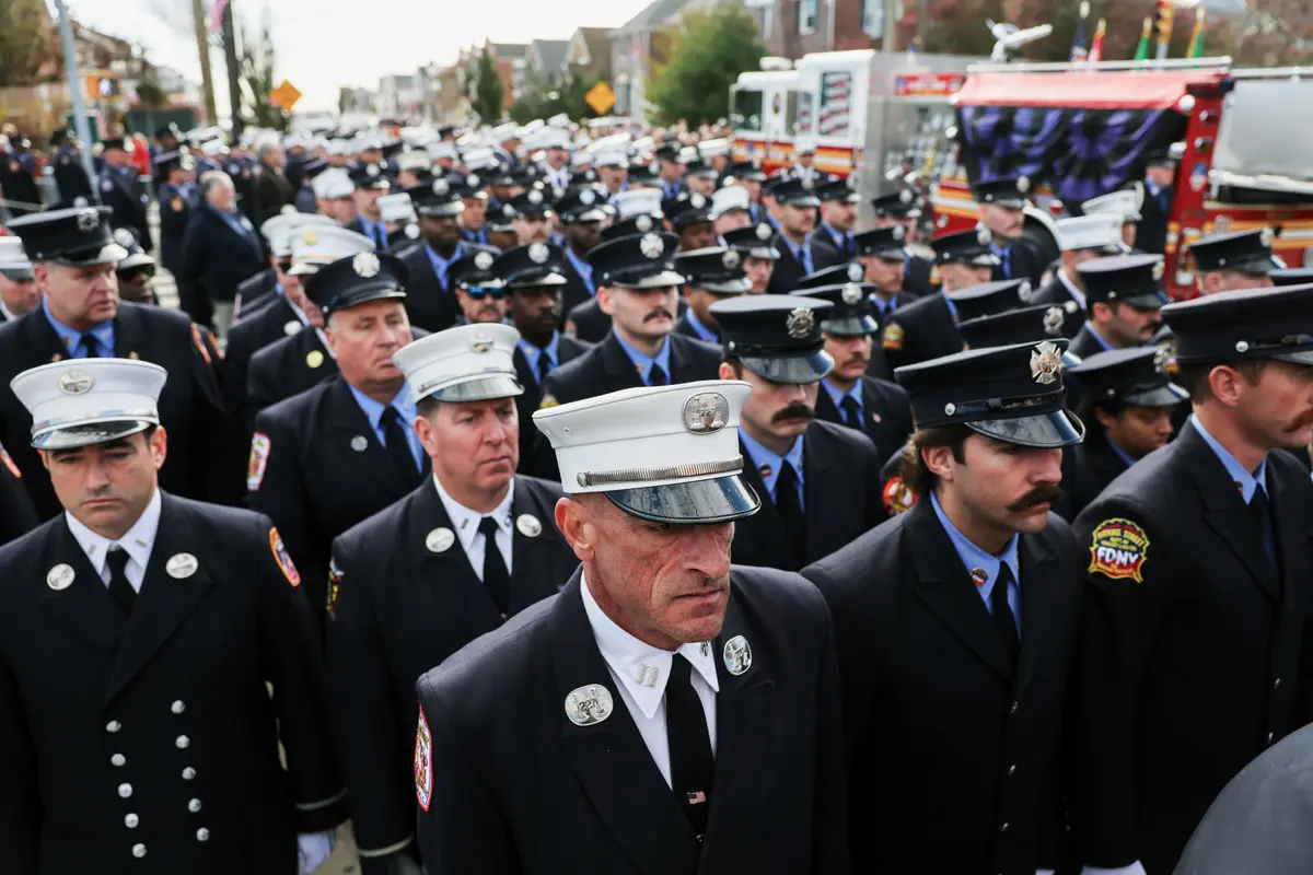Day in Photos: Firefighter’s Funeral, Flooding in the UK, and Explosion in Argentina thumbnail