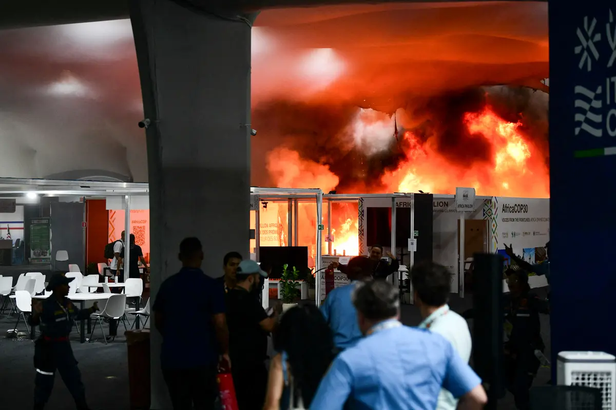 Day in Photos: Fire at the UN Climate Conference, Blackout in Ukraine, and Christmas Market in Germany thumbnail