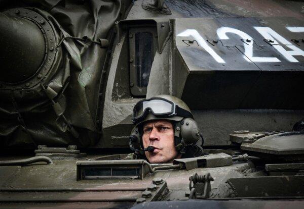 Day in Photos: Military Parade in Romania, White House Christmas Decorations, and a Newborn Baby Gorilla