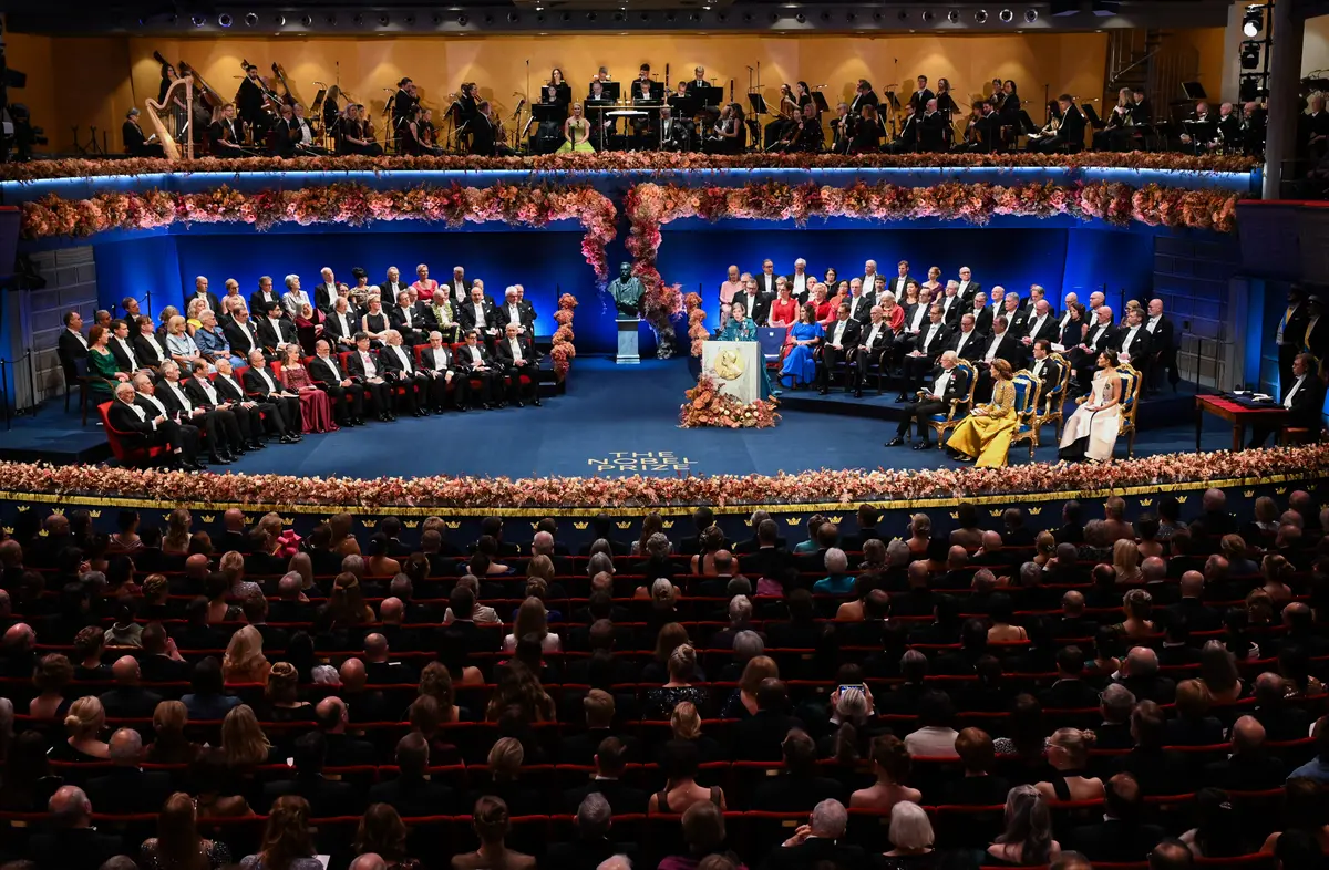 Day in Photos: Nobel Prize Award Ceremony, 2 Buildings Collapse in Morocco, Flooding in England thumbnail