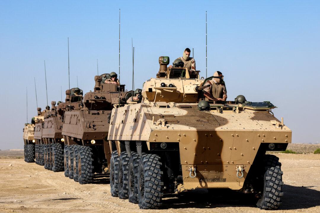 Day in Photos: French Troops in UAE, Protests in Bolivia, and Blue House in Seoul