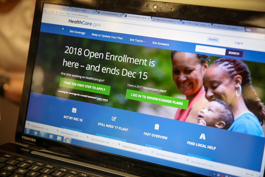 A computer screen shows the enrollment page for the Affordable Care Act in Miami on Nov. 1, 2017. Obamacare aimed to help with both premiums and out-of-pocket costs by providing federal subsidies for low-to-middle-class Americans. (Joe Raedle/Getty Images)