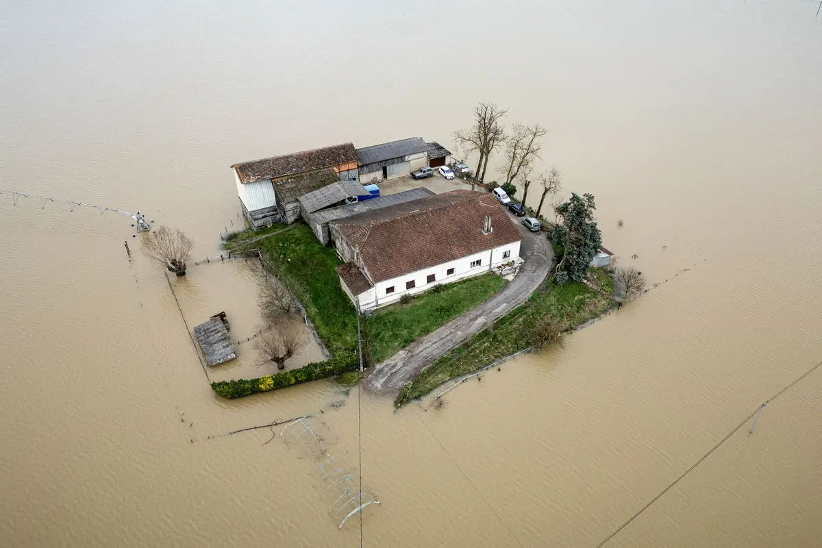 Day in Photos: Floods in France, Supreme Court Tariff Ruling, and Danish King Visits Greenland