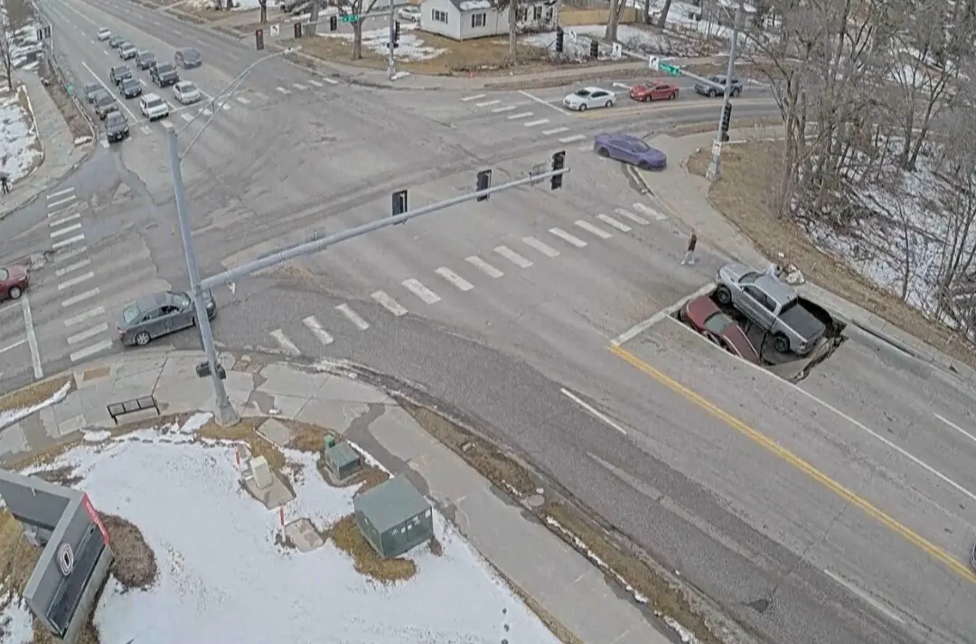 Sinkhole Opens at Omaha Intersection, Swallowing SUV and Pickup Truck