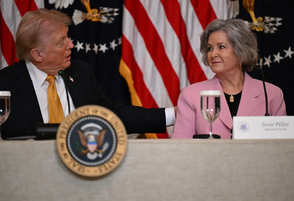 US President Donald Trump speaks with chief of staff Susie Wiles during a lunch with the "Trump Kennedy Center Board" Members at the White House in Washington, DC, on March 16, 2026. (Annabelle GORDON / AFP via Getty Images)