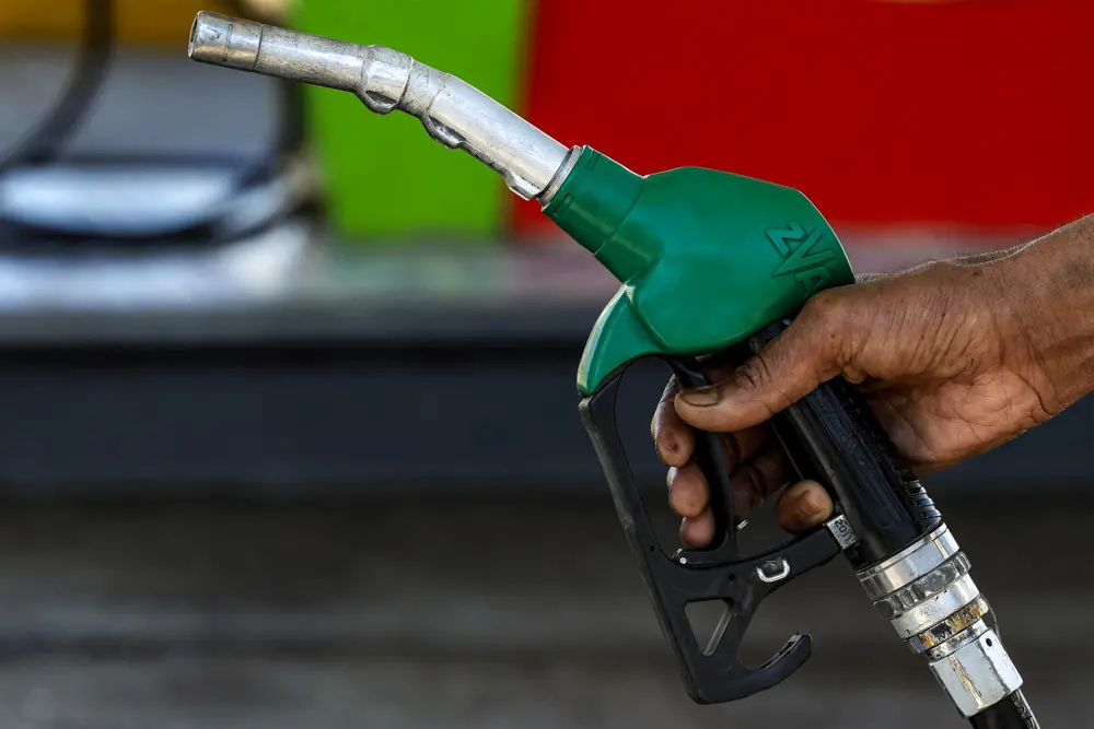 A petrol station worker prepares to fill the tank of a vehicle arriving for a top up in Rabat, Morocco, on March 16, 2026. (Abdel Majid Bziouat/ AFP via Getty Images)