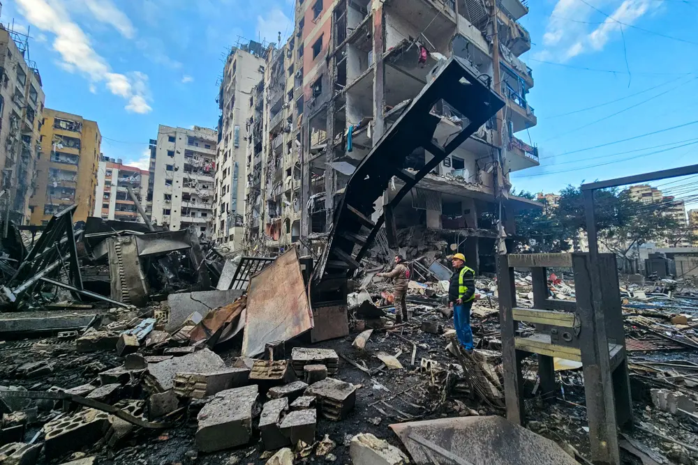 Men inspect a site of overnight Israeli airstrikes in the southern suburbs of Beirut on March 16, 2026. (AFP via Getty Images)