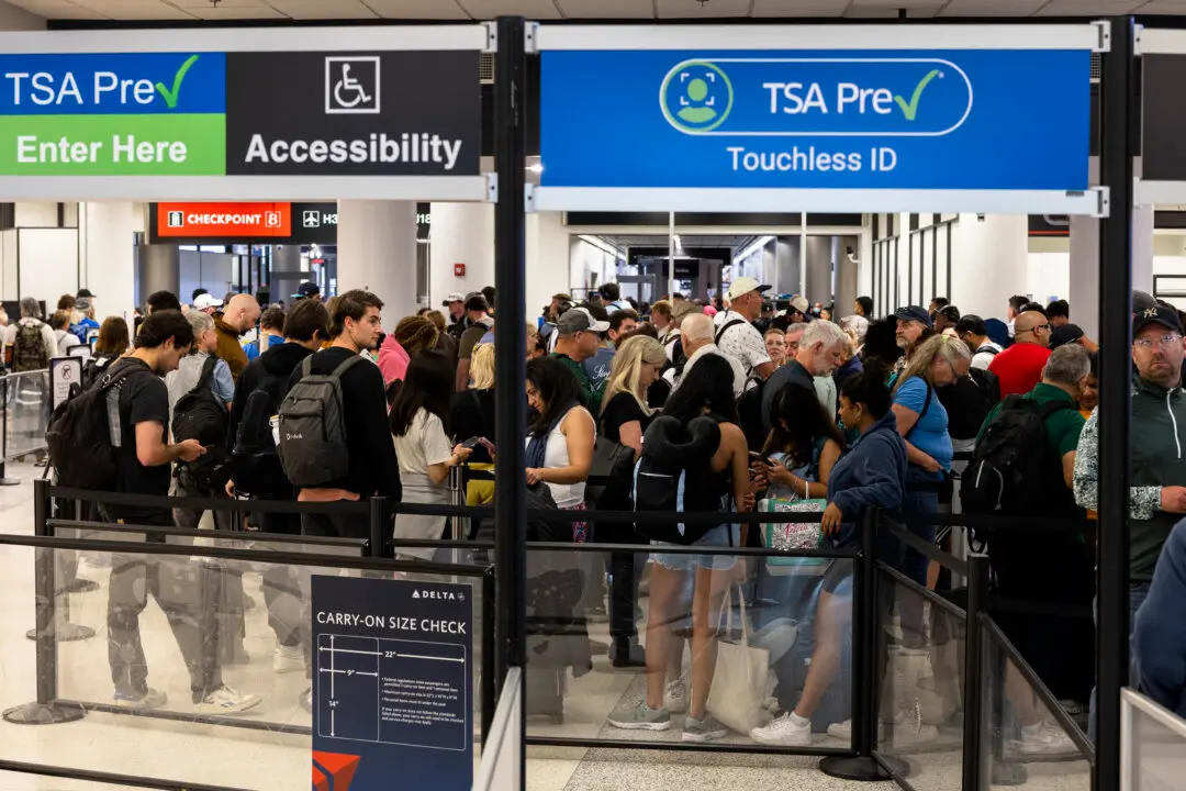 MIAMI, FLORIDA - MARCH 17: Travelers wait in a TSA Pre security line at Miami International Airport on March 17, 2026 in Miami, Florida. Travelers across the country are enduring long airport security lines as a partial federal government shutdown affects the Transportation Security Administration officers working the security lines. (Photo by Joe Raedle/Getty Images)