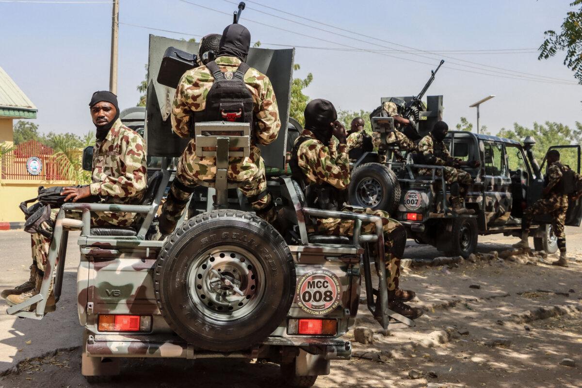 Nigerian soldiers prepare to patrol during the visit of Nigeria's Chief of Defense Staff, General Olufemi Oluyede, to the Headquarters Theatre Command Joint Task Force in Maiduguri on March 18, 2026. (Audu marte/AFP via Getty Images)
