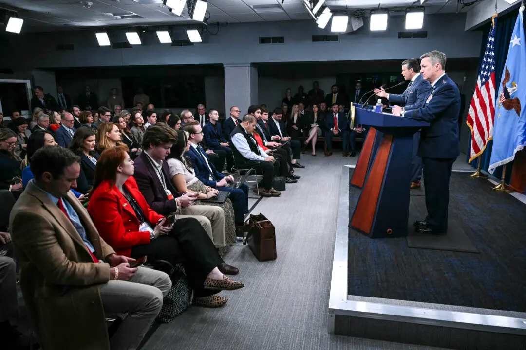 (L/R) US Secretary of Defense Pete Hegseth and Chairman of the Joint Chiefs of Staff General Dan Caine speak during a news conference at the Pentagon in Washington, DC, on March 19, 2026. Oil and gas prices soared Thursday after Iran hit the world's largest liquefied natural gas (LNG) facility in Qatar and threatened to destroy the region's energy infrastructure, and US President Donald Trump warned of a furious US response if such attacks continued. (Photo by Mandel NGAN / AFP via Getty Images)
