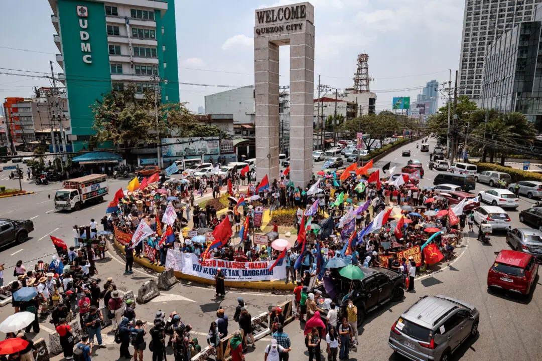 Day in Photos: Prime Minister Sworn-In in Nepal, Scotland Election Campaign, Strike Over Fuel Costs in the Philippines