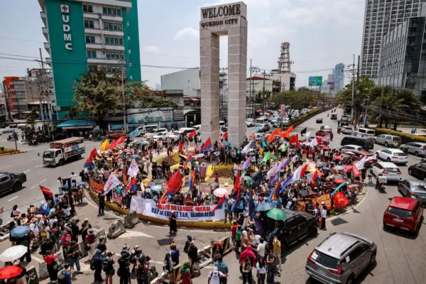 Day in Photos: Prime Minister Sworn-In in Nepal, Scotland Election Campaign, Strike Over Fuel Costs in the Philippines