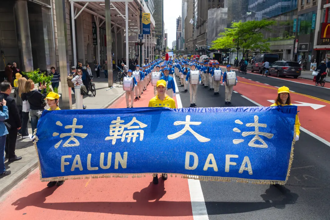 Day in Photos: Falun Dafa Day, Mayor Acting as Agent for China, and National Police Week
