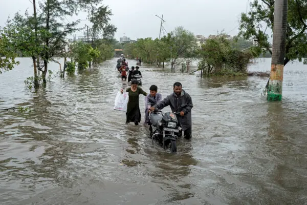 Day in Photos: Heavy Flooding in India, Running of the Bulls, and Underground Aquatic Study