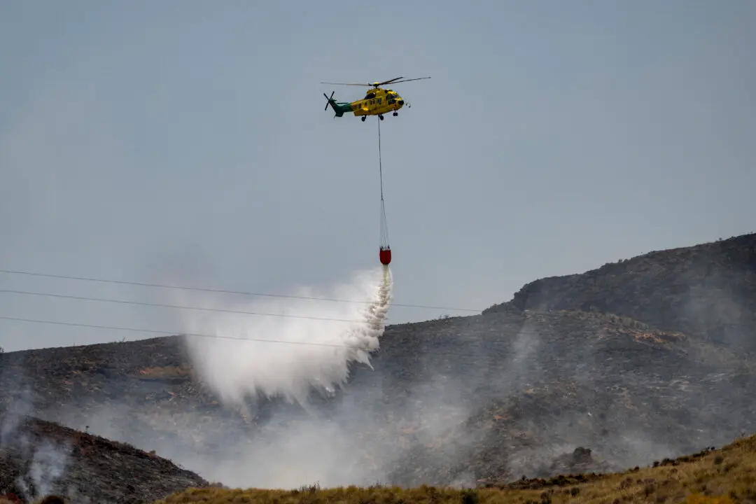 Day in Photos: Devastating Spain Wildfire, Miners’ Gala March, and Float Festival in France