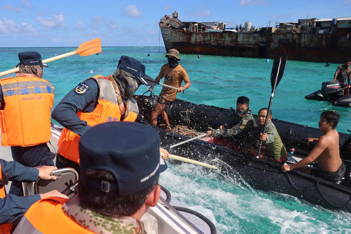 Philippine Navy personnel and Chinese coast guard personnel clash near a grounded Philippine warship at Second Thomas Shoal in the South China Sea, on July 20, 2026. (cnsphoto via Reuters)