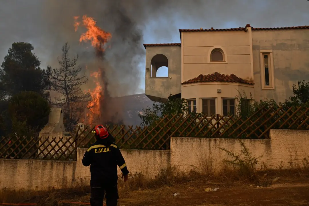 Firefighters Still Battling Fires in Greece After 2 Killed in Helicopter Collision
