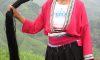 A Yao woman displays her long hair. The Yao women believe that having long hair is an auspicious sign of good health, good fortune, and longevity. (Felibrilu)