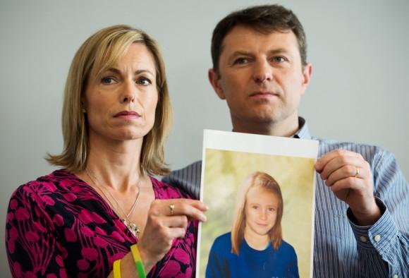 Parents of Madeleine McCann, Kate and Gerry McCann, hold an artist's impression of how their daughter might look at the age of 9, ahead of a press conference in central London in 2012, 5 years after Madeleine's disappearance. (Leon Neal/AFP/Getty Images)