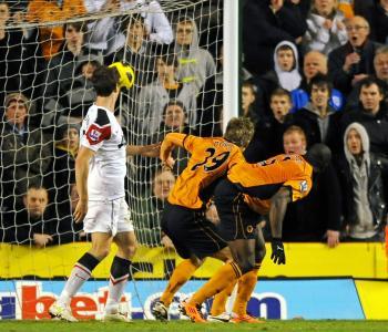 <a href="https://www.theepochtimes.com/assets/uploads/2015/07/108846136wolves_medium.jpg"><img src="https://www.theepochtimes.com/assets/uploads/2015/07/108846136wolves_medium.jpg" alt="Half each, but credited to Doyle ... Wolverhampton Wanderers' Cameroonian defender George Elokobi (R) and team-mate, Irish striker Kevin Doyle (2nd R) watch the ball hit the back of the net. (Adrian Dennis/AFP/Getty Images)" title="Half each, but credited to Doyle ... Wolverhampton Wanderers' Cameroonian defender George Elokobi (R) and team-mate, Irish striker Kevin Doyle (2nd R) watch the ball hit the back of the net. (Adrian Dennis/AFP/Getty Images)" width="320" class="size-medium wp-image-120124"/></a>