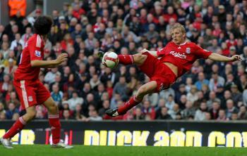 <a href="https://www.theepochtimes.com/assets/uploads/2015/07/83337545_medium.jpg"><img src="https://www.theepochtimes.com/assets/uploads/2015/07/83337545_medium.jpg" alt="GOOD TIMING: Liverpool's Dirk Kuyt (right) connects with bouncing ball to score the winning goal against Wigan Athletic. (Stu Forster/Getty Images)" title="GOOD TIMING: Liverpool's Dirk Kuyt (right) connects with bouncing ball to score the winning goal against Wigan Athletic. (Stu Forster/Getty Images)" width="320" class="size-medium wp-image-137887"/></a>