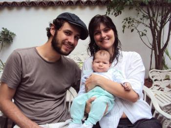 MIRACLE: Taina and Angel Urrutia, and baby Mila, at home in Rio de Janeiro after surviving their ordeal in the Rio mudslide. (Bruno Menezes/Epoch Times)