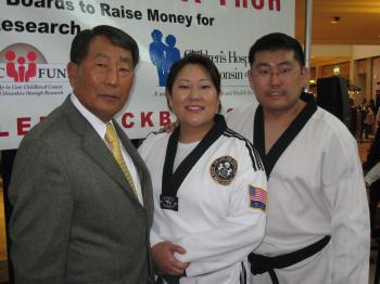 <a href="https://www.theepochtimes.com/assets/uploads/2015/07/Lee+family+pic_medium.jpg"><img src="https://www.theepochtimes.com/assets/uploads/2015/07/Lee+family+pic_medium.jpg" alt="FAMILY PORTRAIT: Grand Master Lee, Chan Lee, and Christine Lee. (Maureen Zebian/The Epoch Times)" title="FAMILY PORTRAIT: Grand Master Lee, Chan Lee, and Christine Lee. (Maureen Zebian/The Epoch Times)" width="320" class="size-medium wp-image-100656"/></a>