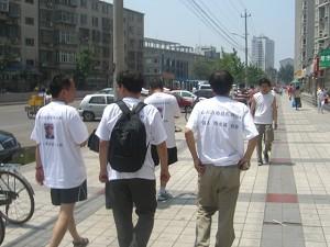 The marchers parade proudly down the avenues of Beijing, calling attention to the plight of Chen Guangcheng. (The Epoch Times)