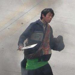 This is a cropped copy of the photo released by the Chinese Embassy purporting to show a Tibetan with a knife taking part in a riot.