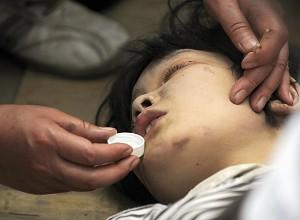 This eleven-year-old girl was rescued after having been trapped for four days. (Liu Jin/AFP/Getty Images)