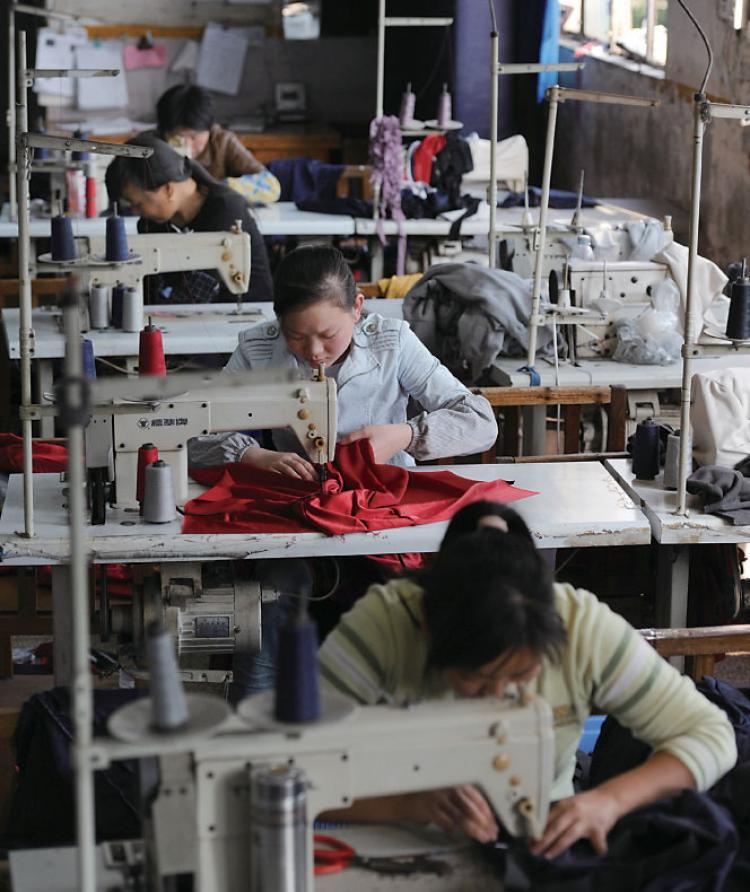 <a><img src="https://www.theepochtimes.com/assets/uploads/2015/09/10-01china.jpg" alt="Women in China working for a Taiwanese Company. Taiwanese businesses in China have been hit hard by labor shortages and rising labor costs. (AFP/Getty Images)" title="Women in China working for a Taiwanese Company. Taiwanese businesses in China have been hit hard by labor shortages and rising labor costs. (AFP/Getty Images)" width="320" class="size-medium wp-image-1808818"/></a>
