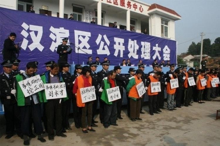<a><img src="https://www.theepochtimes.com/assets/uploads/2015/09/101108144314941.jpg" alt="Local government officials in Shaanxi Province held a public, Cultural Revolution-style shaming session to announce the verdicts against 17 villagers who petitioned the regime for their lost land. Wearing large signs with their names and the verdict, the  (Epoch Times Achives )" title="Local government officials in Shaanxi Province held a public, Cultural Revolution-style shaming session to announce the verdicts against 17 villagers who petitioned the regime for their lost land. Wearing large signs with their names and the verdict, the  (Epoch Times Achives )" width="320" class="size-medium wp-image-1812077"/></a>