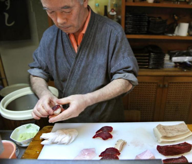 <a><img src="https://www.theepochtimes.com/assets/uploads/2015/09/102236045.jpg" alt="Katsuji Furuuchi makes up a whale sushi from a sliced minke meat and a rice ball in Japanese whaling town Ayukawahama, Miyagi prefecture. (Kazuhiro Nogl/AFP/Getty Images)" title="Katsuji Furuuchi makes up a whale sushi from a sliced minke meat and a rice ball in Japanese whaling town Ayukawahama, Miyagi prefecture. (Kazuhiro Nogl/AFP/Getty Images)" width="320" class="size-medium wp-image-1815100"/></a>