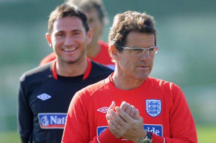 <a><img src="https://www.theepochtimes.com/assets/uploads/2015/09/102262868.jpg" alt="Frank Lampard smiles as England manager Fabio Capello looks on during the England training session at the Royal Bafokeng Sports Campus on June 21, 2010 in Rustenburg, South Africa. (Photo by Michael Regan/Getty Images)" title="Frank Lampard smiles as England manager Fabio Capello looks on during the England training session at the Royal Bafokeng Sports Campus on June 21, 2010 in Rustenburg, South Africa. (Photo by Michael Regan/Getty Images)" width="320" class="size-medium wp-image-1818262"/></a>