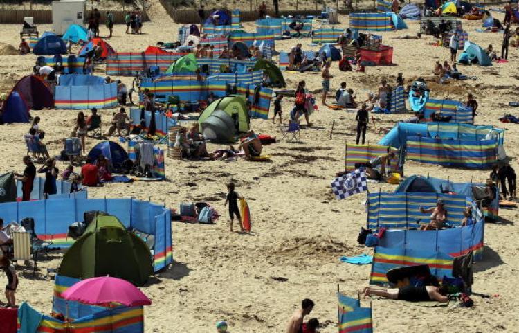<a><img src="https://www.theepochtimes.com/assets/uploads/2015/09/103185071.jpg" alt="Holidaymakers gather at Harlyn Bay near Padstow on July 28, 2010, in Cornwall, England. With good weather forecast many Britons will be making the most of the Bank Holiday weekend. (Getty Images )" title="Holidaymakers gather at Harlyn Bay near Padstow on July 28, 2010, in Cornwall, England. With good weather forecast many Britons will be making the most of the Bank Holiday weekend. (Getty Images )" width="320" class="size-medium wp-image-1815471"/></a>