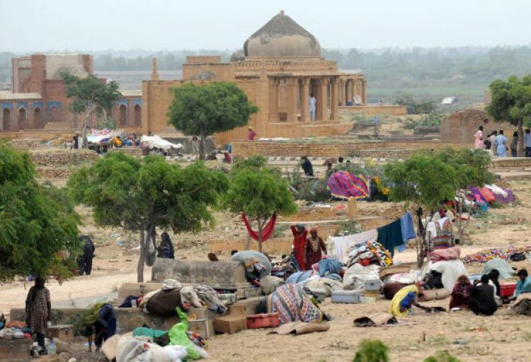 <a><img src="https://www.theepochtimes.com/assets/uploads/2015/09/103740871.jpg" alt="Pakistani flood survivors take shelter in southern Sindh province's Makli on August 31. Flood waters that have devastated Pakistan, covering a fifth of the country and leaving at least 1,600 people dead, are now draining into the Arabian Sea. (Rizwan Tabass/Getty Images )" title="Pakistani flood survivors take shelter in southern Sindh province's Makli on August 31. Flood waters that have devastated Pakistan, covering a fifth of the country and leaving at least 1,600 people dead, are now draining into the Arabian Sea. (Rizwan Tabass/Getty Images )" width="320" class="size-medium wp-image-1815263"/></a>