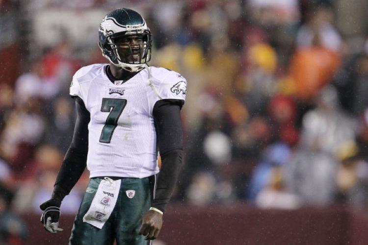 <a><img src="https://www.theepochtimes.com/assets/uploads/2015/09/106898353.jpg" alt="Michael Vick #7 of the Philadelphia Eagles waits for instructions against the Washington Redskins on Nov. 15, at FedExField in Landover, Maryland. (Chris McGrath/Getty Images)" title="Michael Vick #7 of the Philadelphia Eagles waits for instructions against the Washington Redskins on Nov. 15, at FedExField in Landover, Maryland. (Chris McGrath/Getty Images)" width="320" class="size-medium wp-image-1812057"/></a>