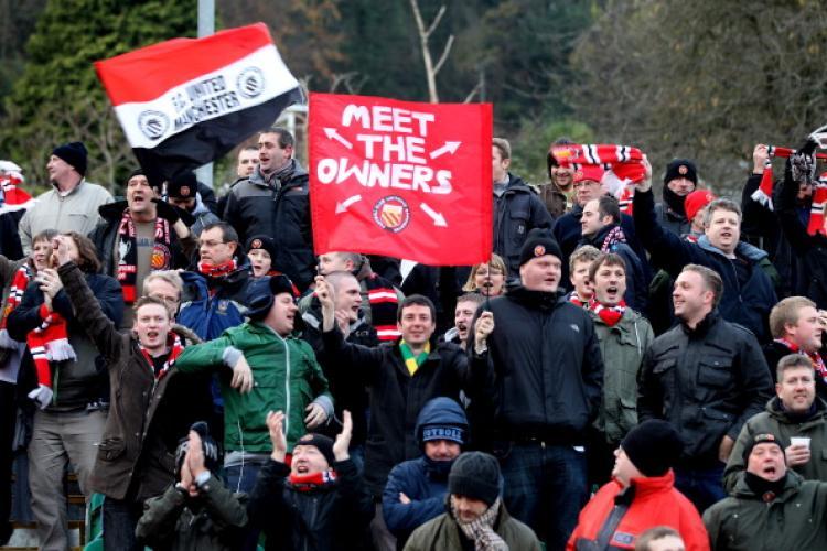 <a><img src="https://www.theepochtimes.com/assets/uploads/2015/09/107168243.jpg" alt="FC UNITED: Fans (owners) of the Manchester club gather during the FA Cup match in Brighton, England on Nov. 27. (Mark Thompson/Getty Images)" title="FC UNITED: Fans (owners) of the Manchester club gather during the FA Cup match in Brighton, England on Nov. 27. (Mark Thompson/Getty Images)" width="320" class="size-medium wp-image-1811454"/></a>
