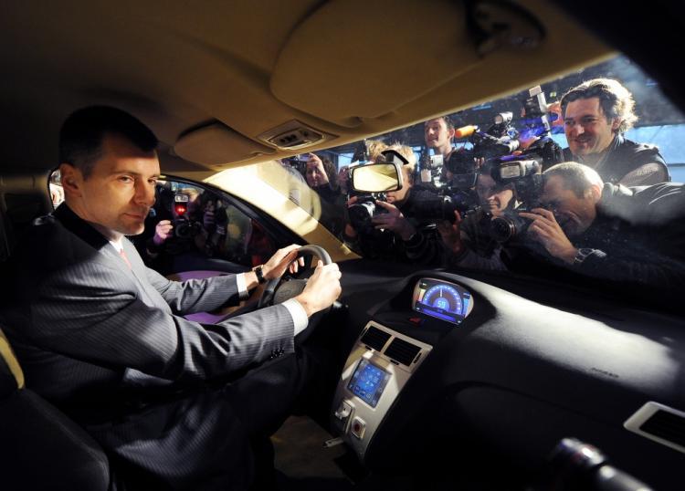 <a><img src="https://www.theepochtimes.com/assets/uploads/2015/09/107551636.jpg" alt="One of the richest men of Russia, Mikhail Prokhorov, sits on December 13, 2010 in a Sport Coupe variant of the E-mobile hybrid cars during the vehicle's presentation in Moscow. (Natalia Kolesnikova/AFP/Getty Images)" title="One of the richest men of Russia, Mikhail Prokhorov, sits on December 13, 2010 in a Sport Coupe variant of the E-mobile hybrid cars during the vehicle's presentation in Moscow. (Natalia Kolesnikova/AFP/Getty Images)" width="320" class="size-medium wp-image-1810951"/></a>