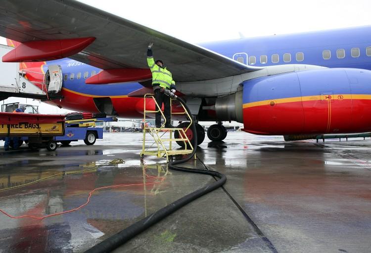 <a><img src="https://www.theepochtimes.com/assets/uploads/2015/09/109405320.jpg" alt="Swissport employee Miroslaw Kaczorowski prepares to refuel a Southwest Airlines plane at the Oakland International Airport on February 24, 2011 in Oakland, California. (Justin Sullivan/Getty Images)" title="Swissport employee Miroslaw Kaczorowski prepares to refuel a Southwest Airlines plane at the Oakland International Airport on February 24, 2011 in Oakland, California. (Justin Sullivan/Getty Images)" width="320" class="size-medium wp-image-1802358"/></a>