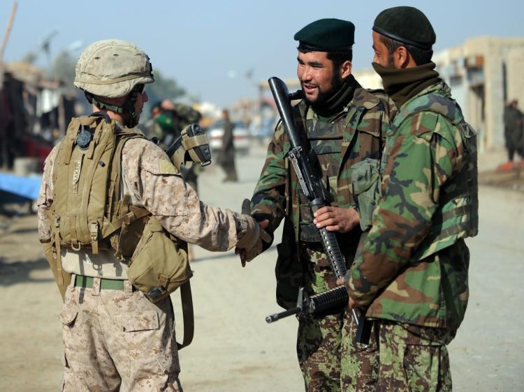 <a><img src="https://www.theepochtimes.com/assets/uploads/2015/09/109827934.jpg" alt="A U.S. Marine of the 2nd Battalion, 1st Marines Regiment (L) shakes hands with Afghanistan national army (ANA) soldiers during a patrol in Garmser, Helmand Province, on March 7. There are around 140,000 international troops, two-thirds of them from the United States in Afghanistan fighting the militant Islamist Taliban. (Adek Berry/AFP/Getty Images)" title="A U.S. Marine of the 2nd Battalion, 1st Marines Regiment (L) shakes hands with Afghanistan national army (ANA) soldiers during a patrol in Garmser, Helmand Province, on March 7. There are around 140,000 international troops, two-thirds of them from the United States in Afghanistan fighting the militant Islamist Taliban. (Adek Berry/AFP/Getty Images)" width="320" class="size-medium wp-image-1806651"/></a>