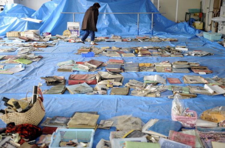 <a><img src="https://www.theepochtimes.com/assets/uploads/2015/09/110868995.jpg" alt="Japan: A survivor checks salvaged memorial pictures and goods on display at a corner of the town hall in Yamada town, Iwate prefecture on March 25, 2011. (Toshifumo Kitamura/AFP/Getty Images)" title="Japan: A survivor checks salvaged memorial pictures and goods on display at a corner of the town hall in Yamada town, Iwate prefecture on March 25, 2011. (Toshifumo Kitamura/AFP/Getty Images)" width="320" class="size-medium wp-image-1804989"/></a>