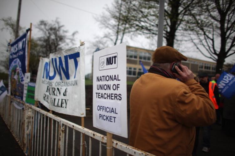 <a><img src="https://www.theepochtimes.com/assets/uploads/2015/09/111797755.jpg" alt="Teachers and staff from Darwen Vale High School picket outside the school as they strike over pupil discipline issues on April 7, 2011 in Blackburn, England. Teachers at the school said pupils frequently challenge them to fights, push and shove them and are constantly swearing and insulting them. When they take the matters to the head teacher, they said she often sides with the pupils instead of staff. (Christopher Furlong/Getty Images)" title="Teachers and staff from Darwen Vale High School picket outside the school as they strike over pupil discipline issues on April 7, 2011 in Blackburn, England. Teachers at the school said pupils frequently challenge them to fights, push and shove them and are constantly swearing and insulting them. When they take the matters to the head teacher, they said she often sides with the pupils instead of staff. (Christopher Furlong/Getty Images)" width="320" class="size-medium wp-image-1804505"/></a>