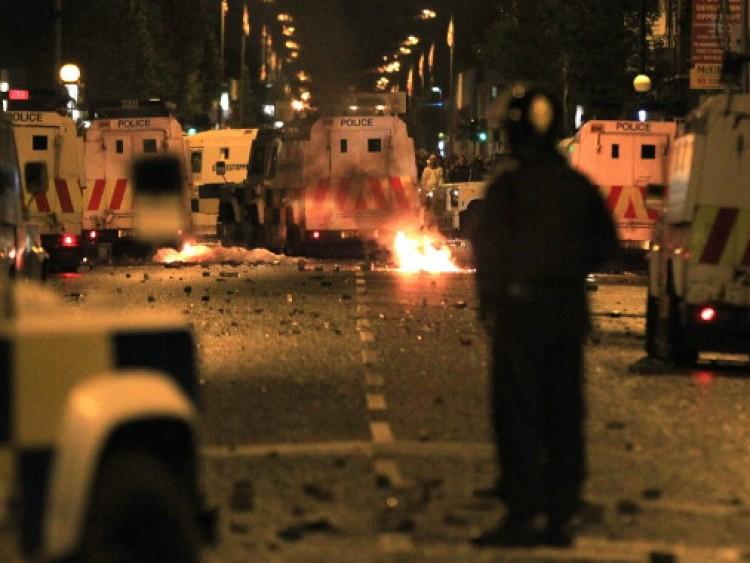 <a><img src="https://www.theepochtimes.com/assets/uploads/2015/09/117091533.jpg" alt="A policeman stands burning amid debris and police vehicles in east Belfast, Northern Ireland on June 21, 2011. (Peter Muhly/AFP/Getty Images)" title="A policeman stands burning amid debris and police vehicles in east Belfast, Northern Ireland on June 21, 2011. (Peter Muhly/AFP/Getty Images)" width="320" class="size-medium wp-image-1802250"/></a>