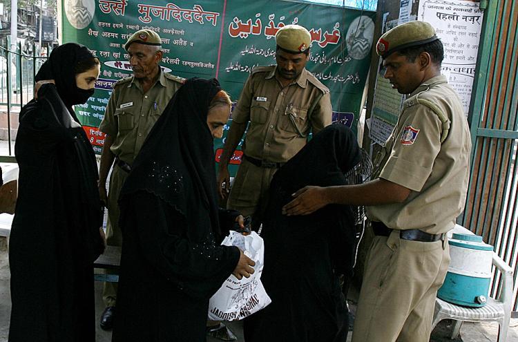 <a><img src="https://www.theepochtimes.com/assets/uploads/2015/09/11nbombla.jpg" alt="Indian police check the bags of Indian Muslim women visiting the Jama Masjid mosque (Background) in New Delhi on July 27, 2008, after security was put on high alert across the country following the bomb blasts in Ahmedabad. (Manpreet Romana/AFP/Getty Images)" title="Indian police check the bags of Indian Muslim women visiting the Jama Masjid mosque (Background) in New Delhi on July 27, 2008, after security was put on high alert across the country following the bomb blasts in Ahmedabad. (Manpreet Romana/AFP/Getty Images)" width="320" class="size-medium wp-image-1834740"/></a>
