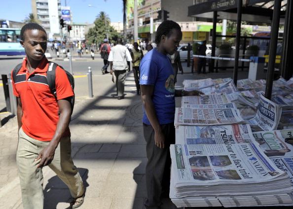 <a><img class="size-large wp-image-1792767" title="A man walks past a news stand displaying" src="https://www.theepochtimes.com/assets/uploads/2015/09/137642141.jpg" alt="" width="590" height="421"/></a>