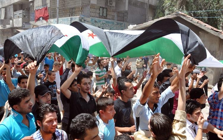 <a><img class="size-large wp-image-1784173" title="Holding up the the first flag of the Baa" src="https://www.theepochtimes.com/assets/uploads/2015/09/149395308.jpg" alt="" width="590" height="372"/></a>