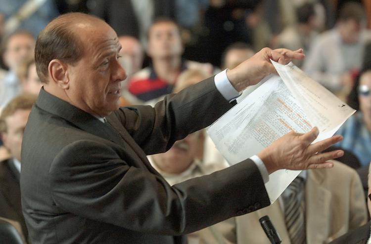 <a><img src="https://www.theepochtimes.com/assets/uploads/2015/09/2088731.jpg" alt="Italian Prime Minister Silvio Berlusconi addresses a courtroom on June 17, 2003 in Milan, Italy. Berlusconi was in tribunal to defend himself against corruption charges linked to his media company. (Giuseppe Cacace/Getty Images)" title="Italian Prime Minister Silvio Berlusconi addresses a courtroom on June 17, 2003 in Milan, Italy. Berlusconi was in tribunal to defend himself against corruption charges linked to his media company. (Giuseppe Cacace/Getty Images)" width="320" class="size-medium wp-image-1825860"/></a>