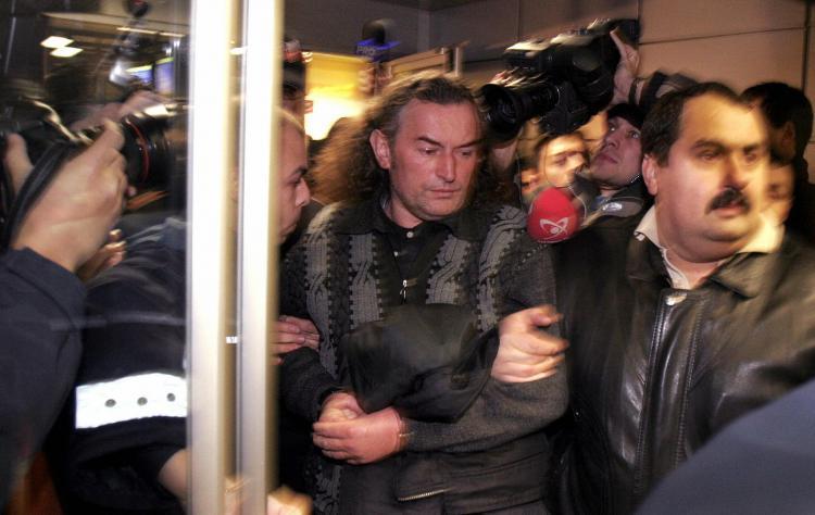 <a><img src="https://www.theepochtimes.com/assets/uploads/2015/09/51875818_romanian.jpg" alt="Former Romanian miners' leader Miron Cozma (C) is escorted by policemen after he was arrested in Timisoara, some 550 kms west of Bucharest, December 17, 2004. (Petrut Calinescu/AFP/Getty Images)" title="Former Romanian miners' leader Miron Cozma (C) is escorted by policemen after he was arrested in Timisoara, some 550 kms west of Bucharest, December 17, 2004. (Petrut Calinescu/AFP/Getty Images)" width="320" class="size-medium wp-image-1827693"/></a>
