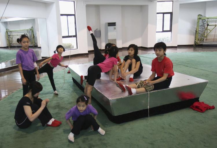 <a><img src="https://www.theepochtimes.com/assets/uploads/2015/09/72258737.jpg" alt="Young Chinese acrobats resting after training. In China enormous emphasis and funding are being given to elite sports, while neglecting sporting activities for the masses. The overall health of Chinese youth is in decline with the average fitness and health-related expenditure for a Beijing resident is only 73 yuan, ($11 US). (Getty Images )" title="Young Chinese acrobats resting after training. In China enormous emphasis and funding are being given to elite sports, while neglecting sporting activities for the masses. The overall health of Chinese youth is in decline with the average fitness and health-related expenditure for a Beijing resident is only 73 yuan, ($11 US). (Getty Images )" width="320" class="size-medium wp-image-1811148"/></a>